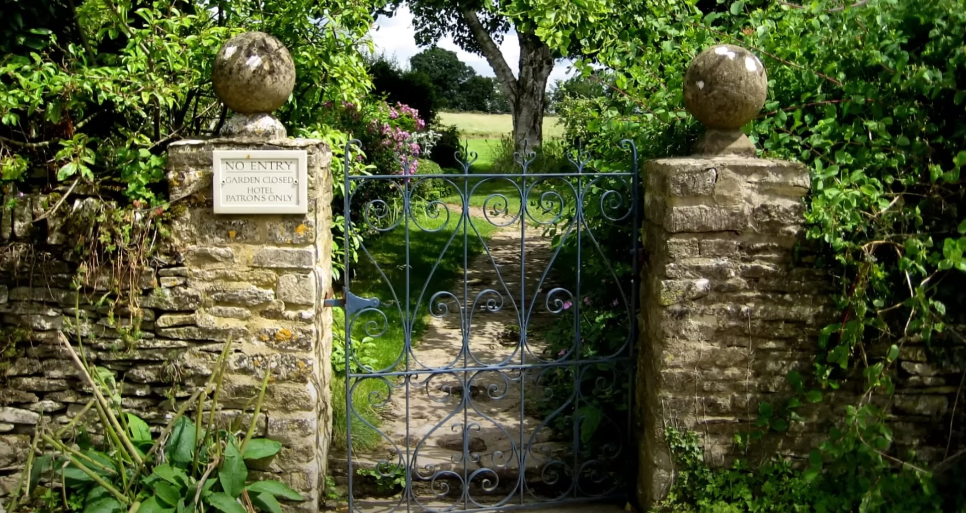 Beautiful garden courtyard with flowering plants and architectural elements